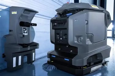 Robot autolaveuse autonome en action sur un sol de site industriel — nettoyage BtoB assisté par IA