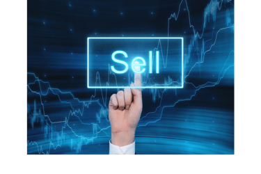 a hand holding a sign that says sell