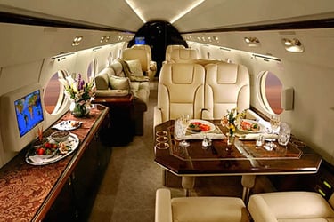 Luxury private jet cabin featuring elegant dining, plush leather seating, and premium in-flight service. Designed for elite t