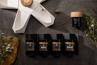 Product photography - a variety of honey products styled on a stone tile