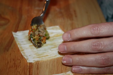placing filling on wonton wrapper