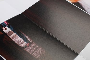A wedding album opening to show open flat thick pages