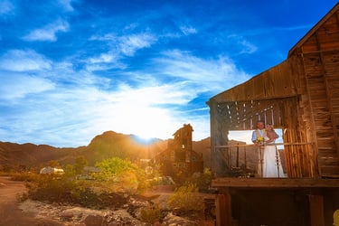 wedding couple pose for a sunset photo at nelson ghost town
