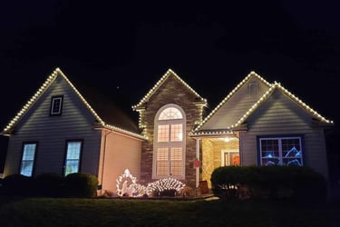 Charming home adorned with colorful Christmas lights, radiating festive cheer and holiday spirit.