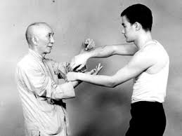 Grandmaster Yip man training his student Bruce Lee
