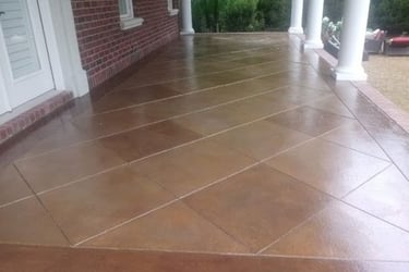 a porch with a brick wall and a brick wall