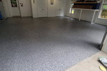 a garage flooring with a garage flooring and a garage door