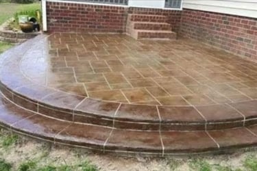 a patio with a brick patio with a brick patio