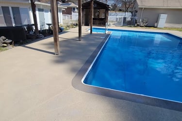 a pool with a patio and a patio area