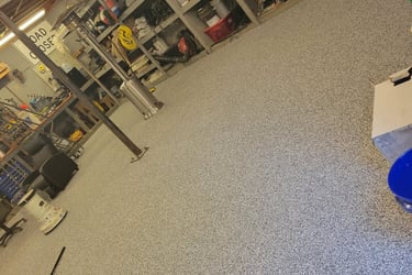 a room with a blue and white flooring and a blue floor