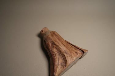 Rustic handmade wooden bench with natural grain texture and mortise and tenon joinery on a white background.