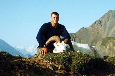 Successful Alaskan Dall Sheep expedition showing a trophy harvest in the high country.