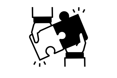 Two puzzle pieces coming together - collaboration