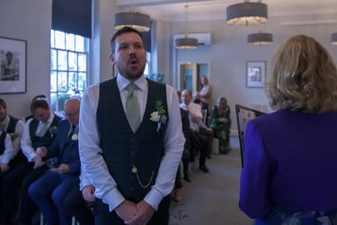 Groom waiting for his bride at Bury St Edmunds Registry Office.