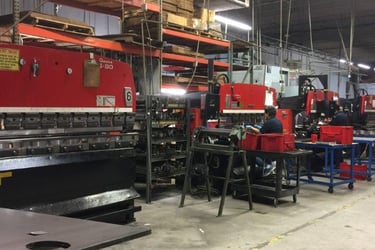 precision fabrication of stainless steel cabinets using industrial machinery