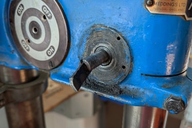 The image shows the faulty area on the vintage pillar drill.