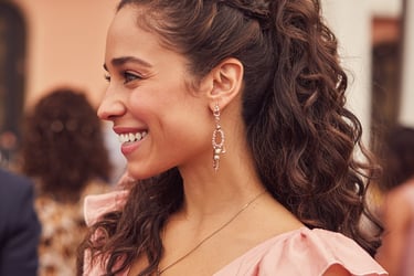 Half up half down wedding guest hairstyle soft curls