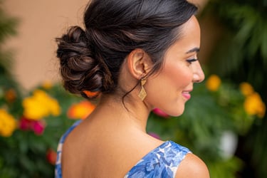 Elegant low bun wedding guest hairstyle with soft tendrils