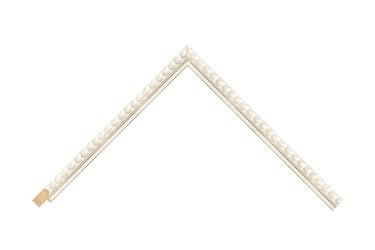 A narrow white painted frame with intricately textural beaded detail.