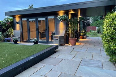 Dark grey composite wood garden room