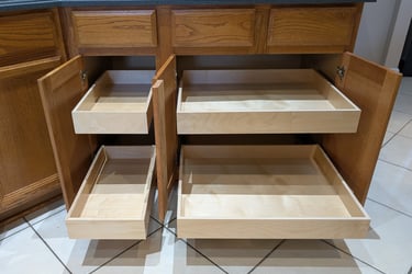Sliding drawers for cabinets in a kitchen. 