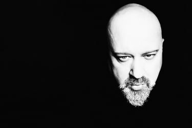 Dramatic black and white high-contrast portrait of Sébastien Lovat