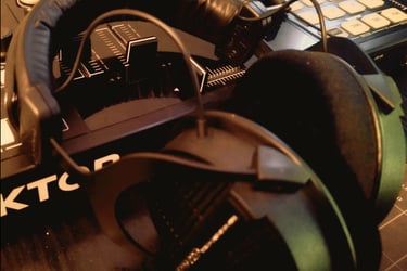 Professional audio editing headphones on DJ controller