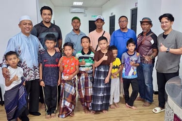 A group of young boys and men posing together in a building after a traditional circumcision ceremony.