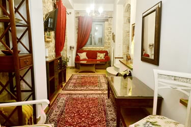 a living room with a red carpet and a red rug