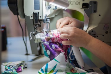 Men’s leggings and women’s leggings being printed, cut and sewn in the United States