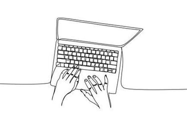 a person's hands on a laptop computer