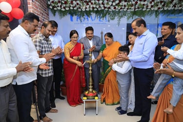 Inauguration ceremony of Vibha Tours LLP's new office in Mysore, featuring a traditional lamp-lighti