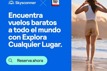 Skyscanner ad for cheap flights worldwide showing a woman walking on a beach at sunset.
