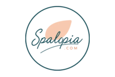 Spalopia.com official logo featuring elegant script text and a peach leaf icon in a circular frame.