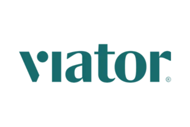 Viator official logo in teal green typeface on a solid black background for travel bookings.