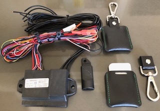Laserline Guardian immobiliser set with control unit, wiring harness, and key fob.