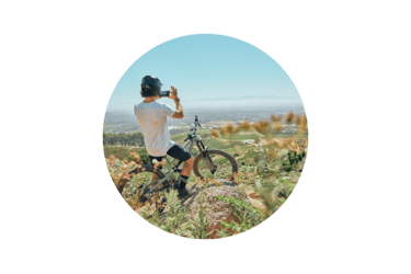 social media profile picture man on bike taking a photo