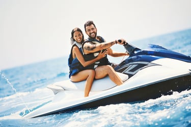 a man and woman riding a jetski in Tenerife