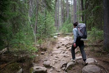 Man hiking with the Rab muon 50L backpack.
