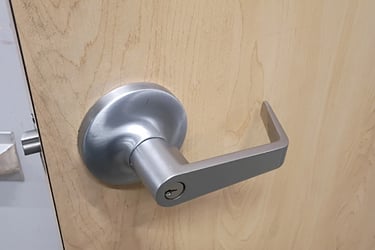 Office door lever lock rekeyed by commercial locksmith in Asheville NC.