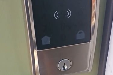 Smart keypad deadbolt lock installed on a residential door in Asheville, NC