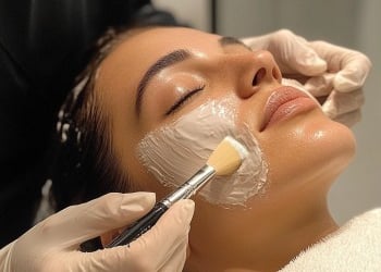 a woman in Bolton getting her face covered in facial masks