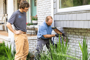 Clint Smith (Owner) Performing a pest control prevention operation
