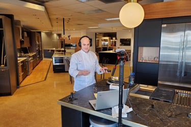 Chef Andrew recording a podcast in a showroom.