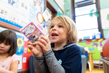 boy engaging with oopa movement card