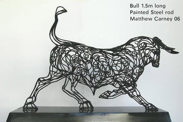 an intricate metal bull sculpture
