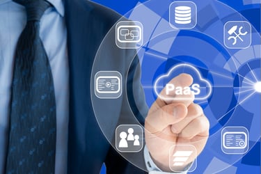 Businessman pressing PaaS icon on virtual screen with cloud service and architecture symbols