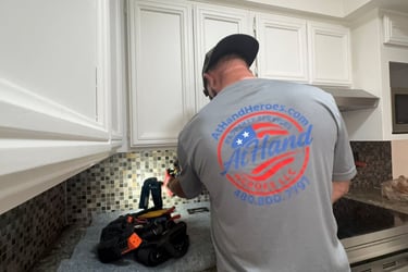 Handyman repairing kitchen outlet not working