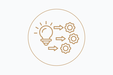 drawing of a light bulb and a gear with arrows in the center