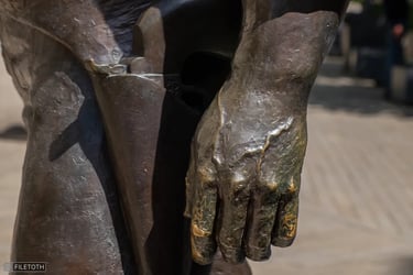 Close-up of Bud Spencer’s left hand, with a revolver visible in the holster at his waist.